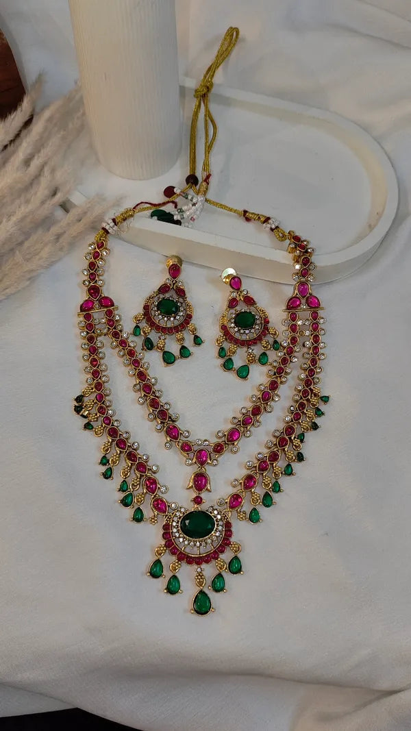 Emerald green and ruby pink stones